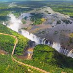 Victoria Falls (or Mosi-oa-Tunya (Tokaleya Tonga: the Smoke that Thunders) is a waterfall in southern Africa on the Zambezi River at the border of Zambia and Zimbabwe.